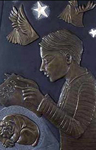 detail showing a young boy reading a book, while a dog sleeps beneath his arms, and winged books fly over head among stars